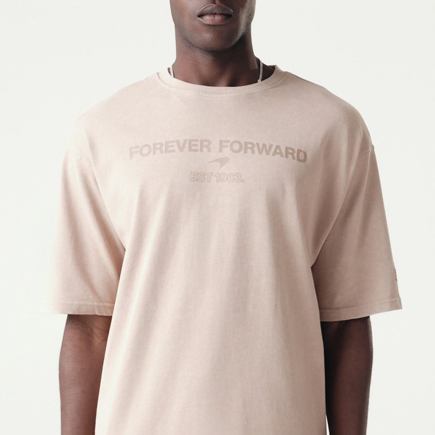 The Male model is wearing McLaren Racing Washed Pack Beige Oversized T-Shirt 3