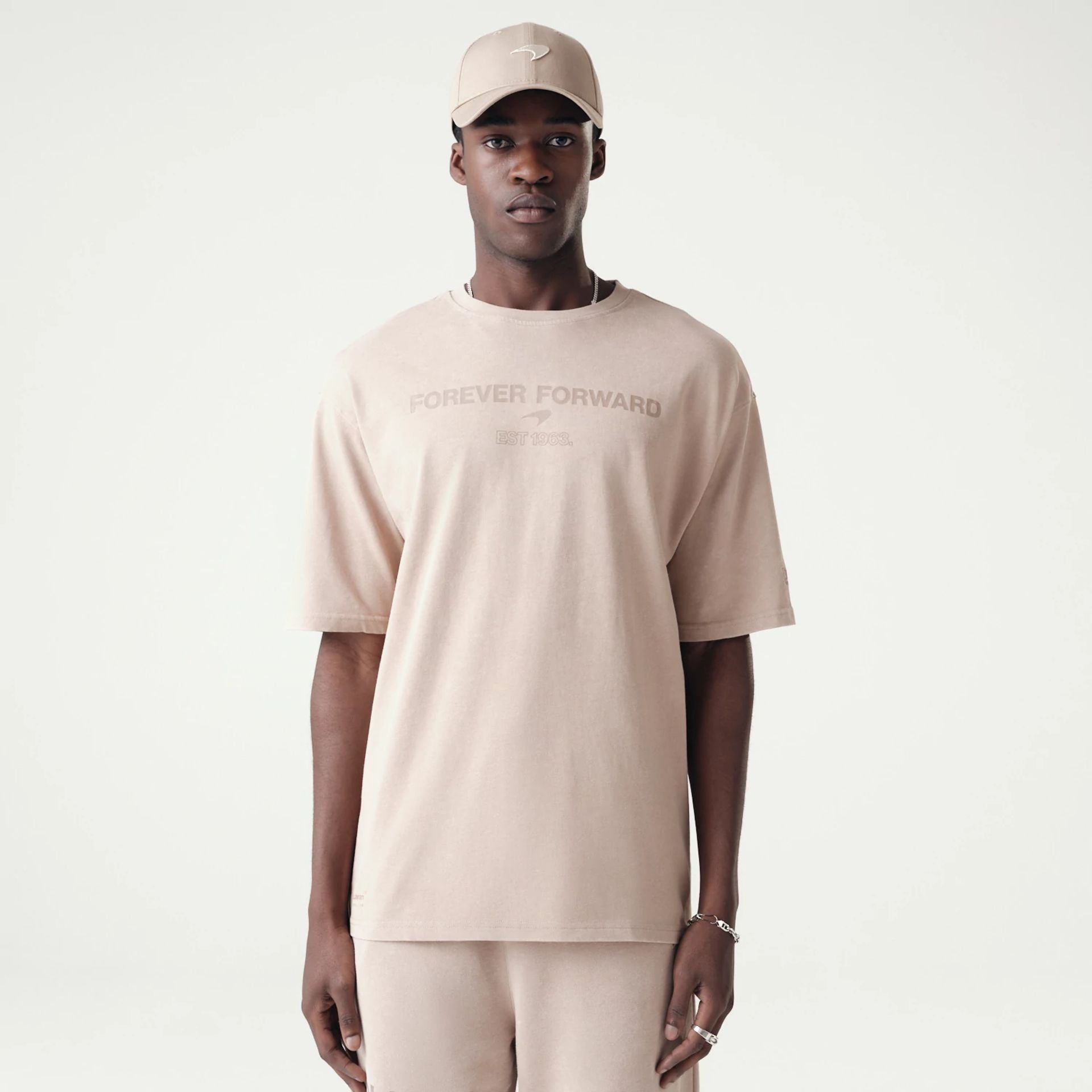 The Male model is wearing McLaren Racing Washed Pack Beige Oversized T-Shirt 1