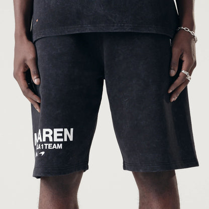 The Male model is wearing McLaren Racing Washed Pack Black Oversized Shorts 3