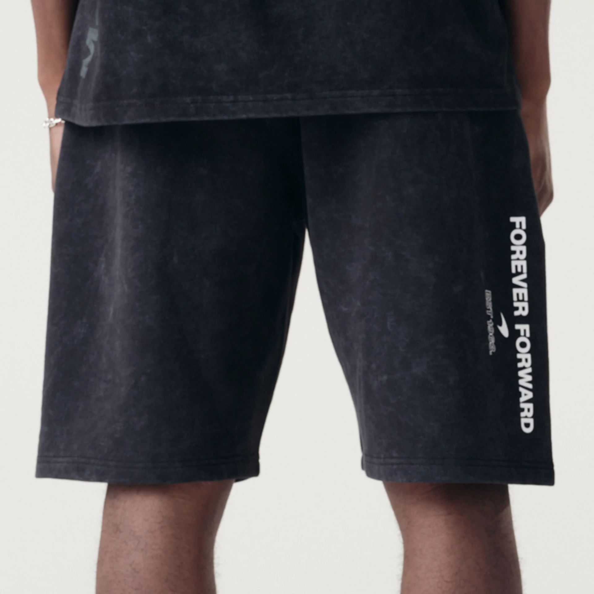 The Male model is wearing McLaren Racing Washed Pack Black Oversized Shorts 6