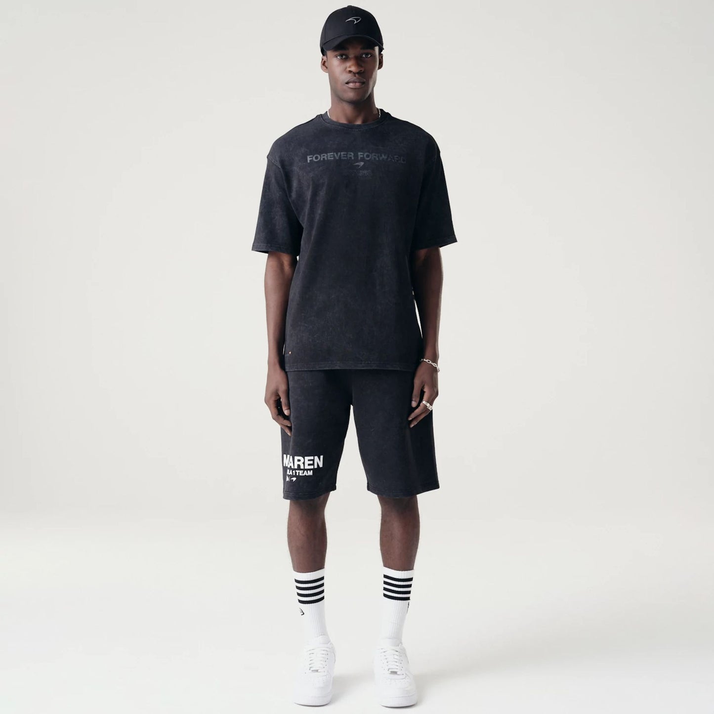 The Male model is wearing McLaren Racing Washed Pack Black Oversized Shorts 8