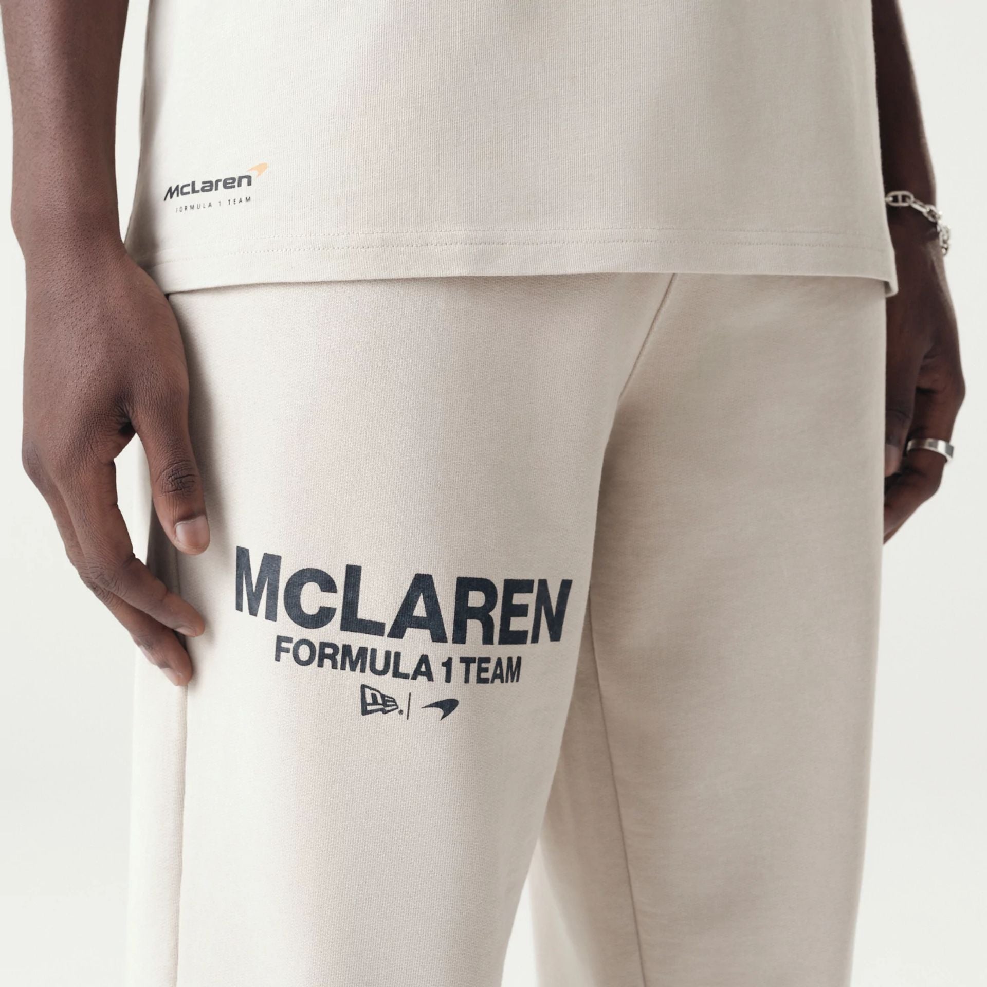 The Male model is wearing McLaren Racing Washed Pack Cream Straight Leg Joggers 5