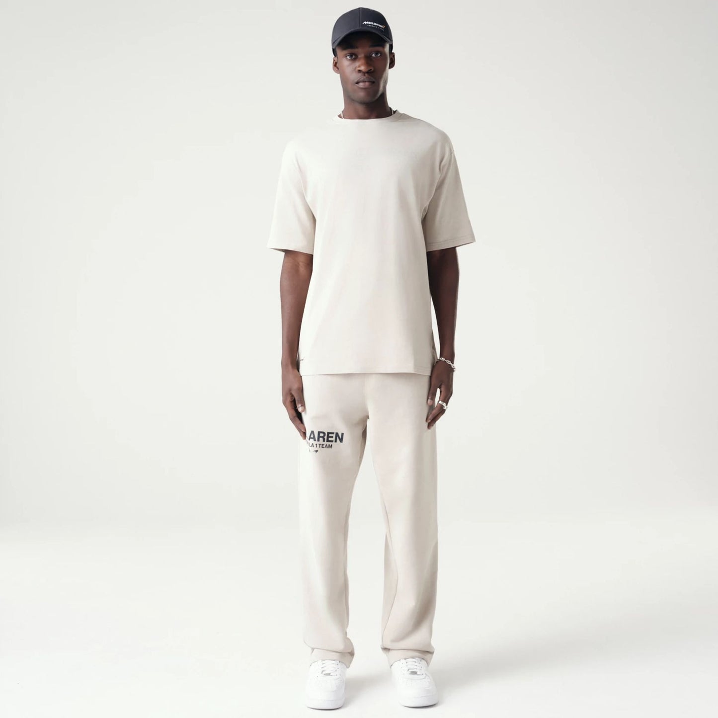 The Male model is wearing McLaren Racing Washed Pack Cream Straight Leg Joggers 8