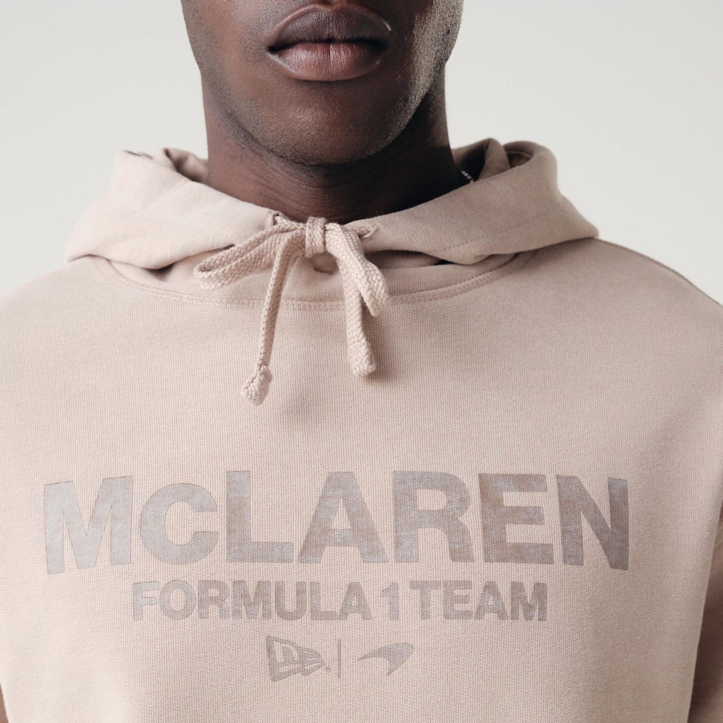 The Male model is wearing McLaren Racing Washed Pack Beige Oversized Hoodie 6