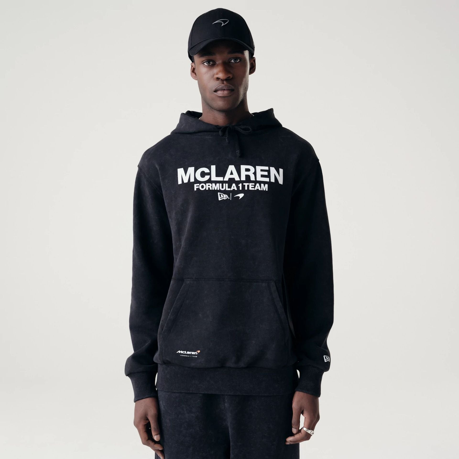 The Male model is wearing McLaren Racing Washed Pack Black Oversized Hoodie 1