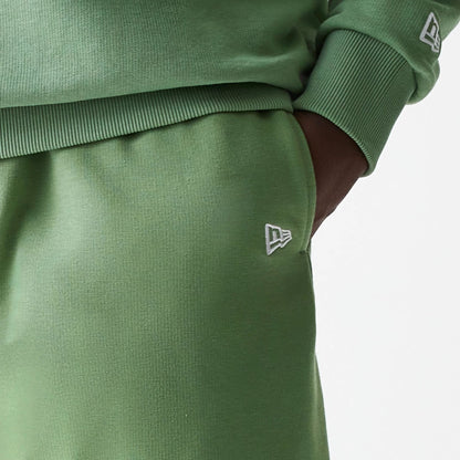 The Male model is wearing New Era Green Oversized One Panel Shorts 5