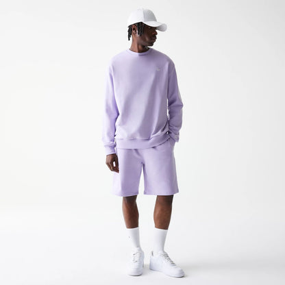 The Male model is wearing New Era Pastel Purple Oversized One Panel Shorts 7