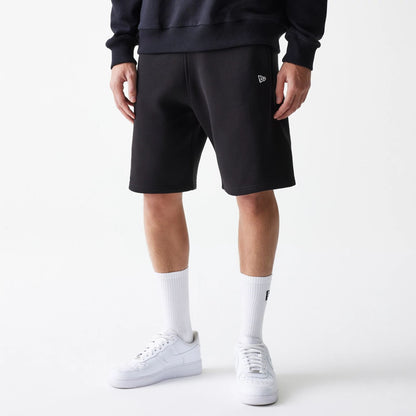 The Male model is wearing New Era Black Oversized One Panel Shorts 6