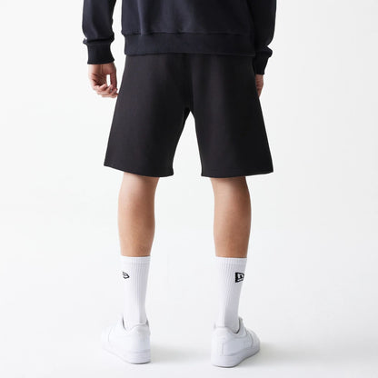 The Male model is wearing New Era Black Oversized One Panel Shorts 2