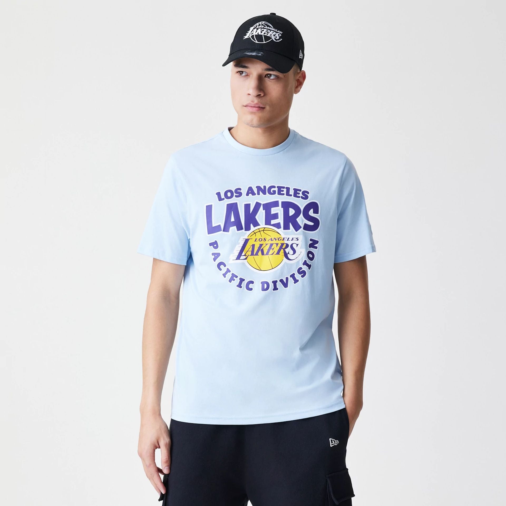 The Male model is wearing LA Lakers NBA Bubble Wordmark Pastel Blue T-Shirt 1