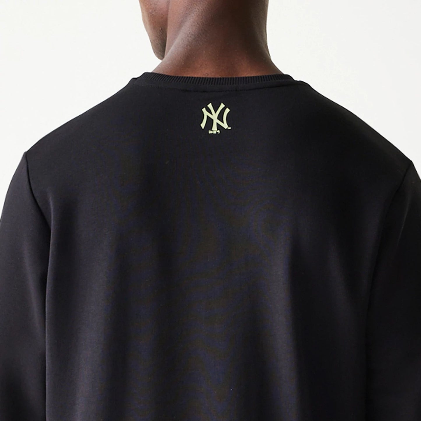 The Male model is wearing New York Yankees MLB Glow Black Crewneck Sweater 8