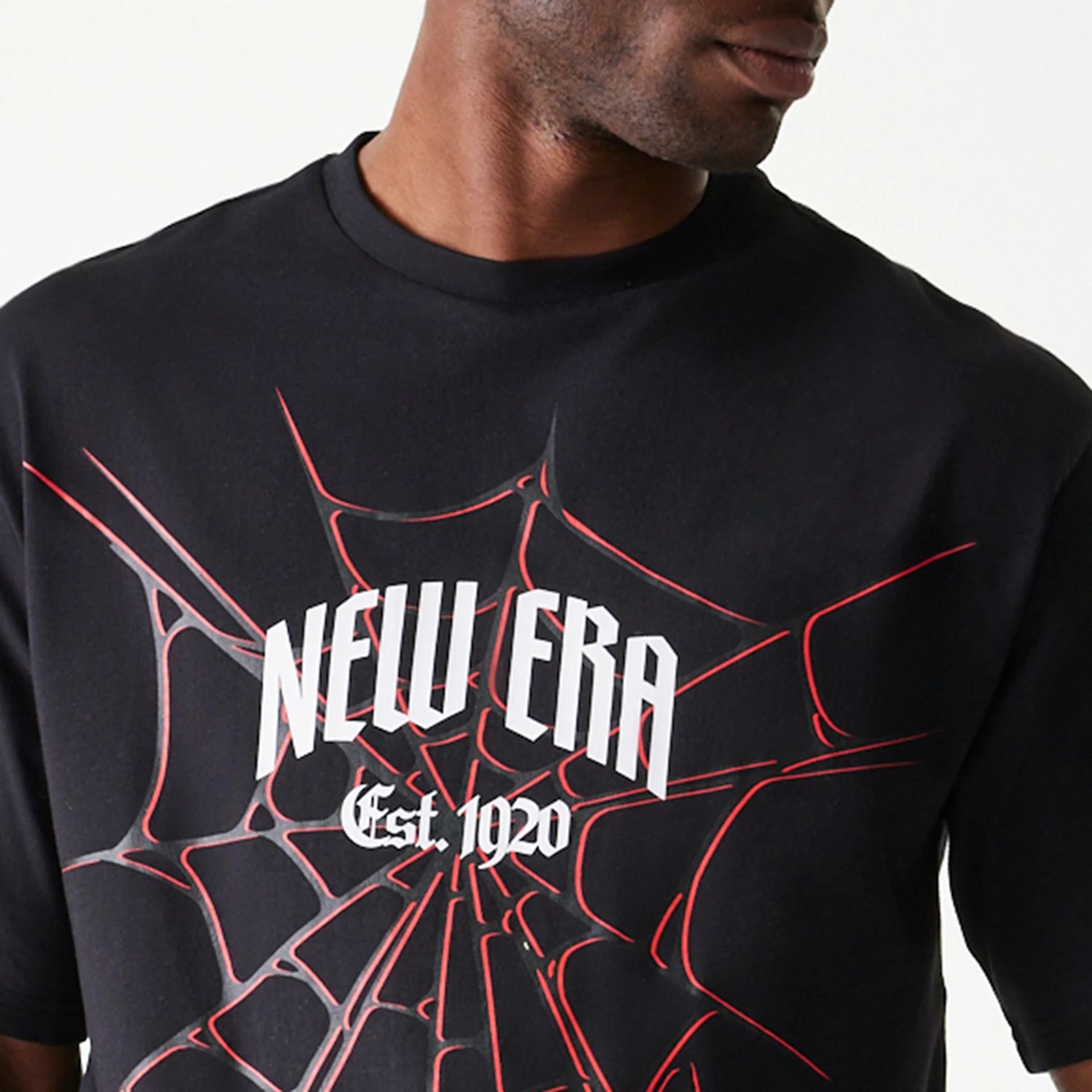 The Male model is wearing New Era Spiderweb Black Oversized T-Shirt 3