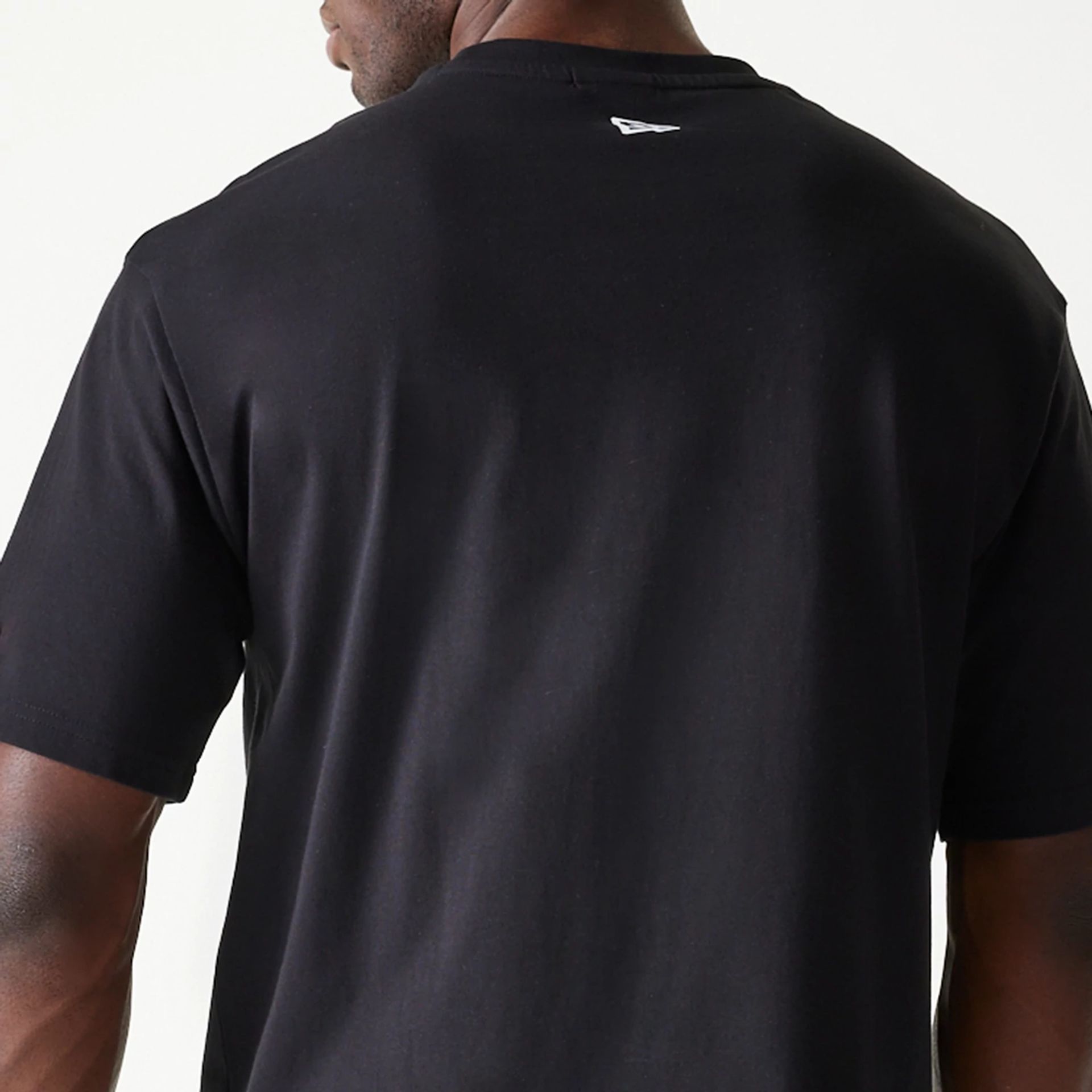 The Male model is wearing New Era Spiderweb Black Oversized T-Shirt 7