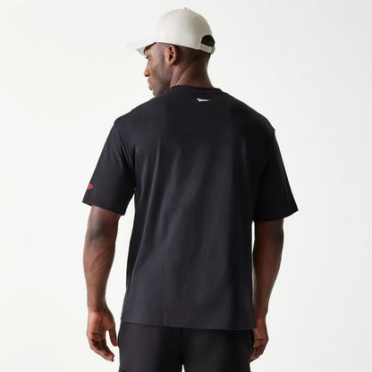 The Male model is wearing New Era Spiderweb Black Oversized T-Shirt 2